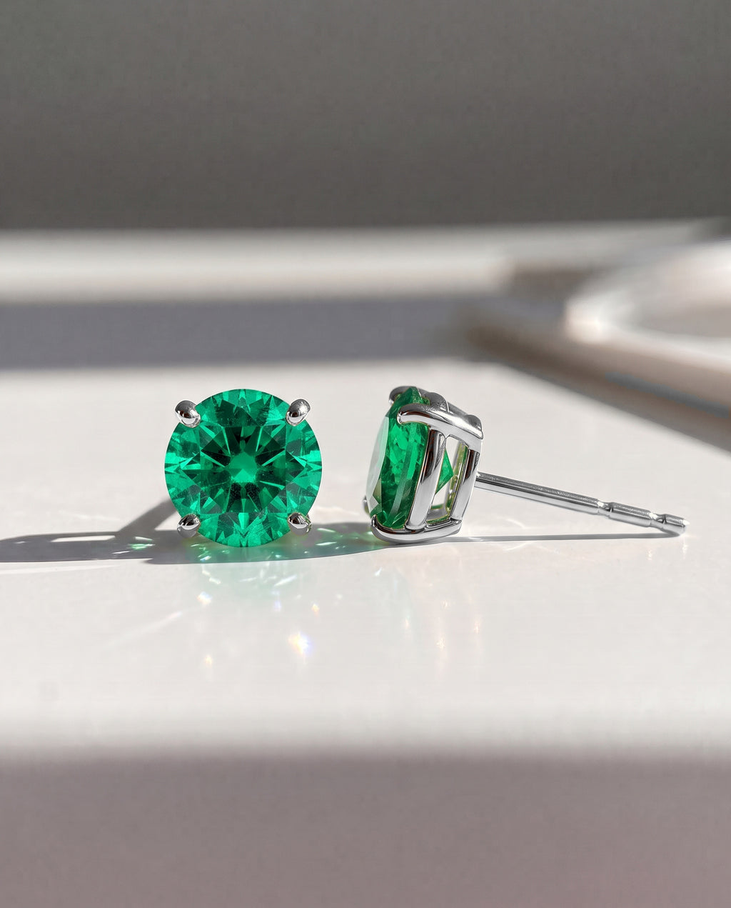 Round Emerald Solitaire Ear Studs in 9ct white gold